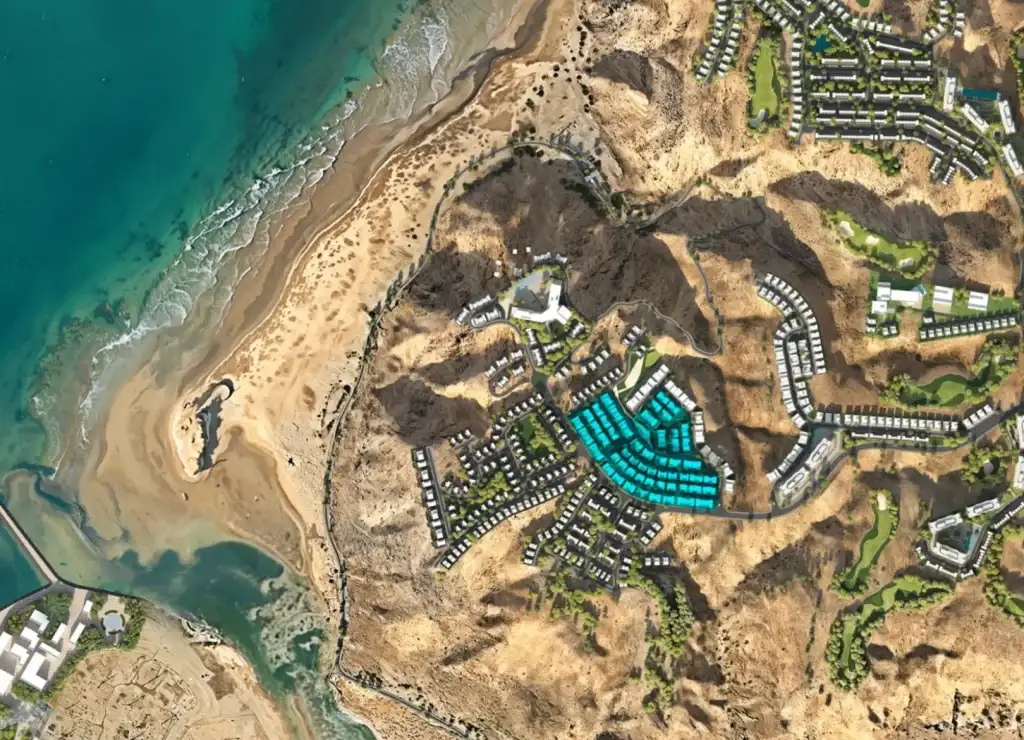 Coastal development with sandy beach nearby.