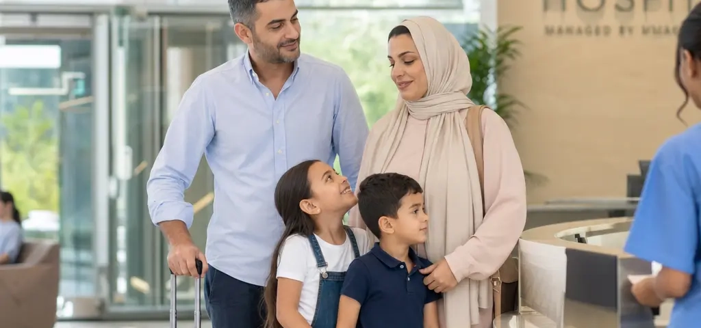 Expat Family Outside A Modern Hospital In Muscat, Oman