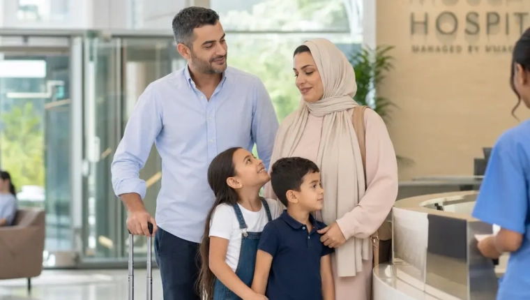 Expat Family Outside A Modern Hospital In Muscat, Oman