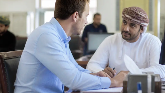 Expat Completing Residence Card Formalities At A Muscat Civil-Status Service Centre